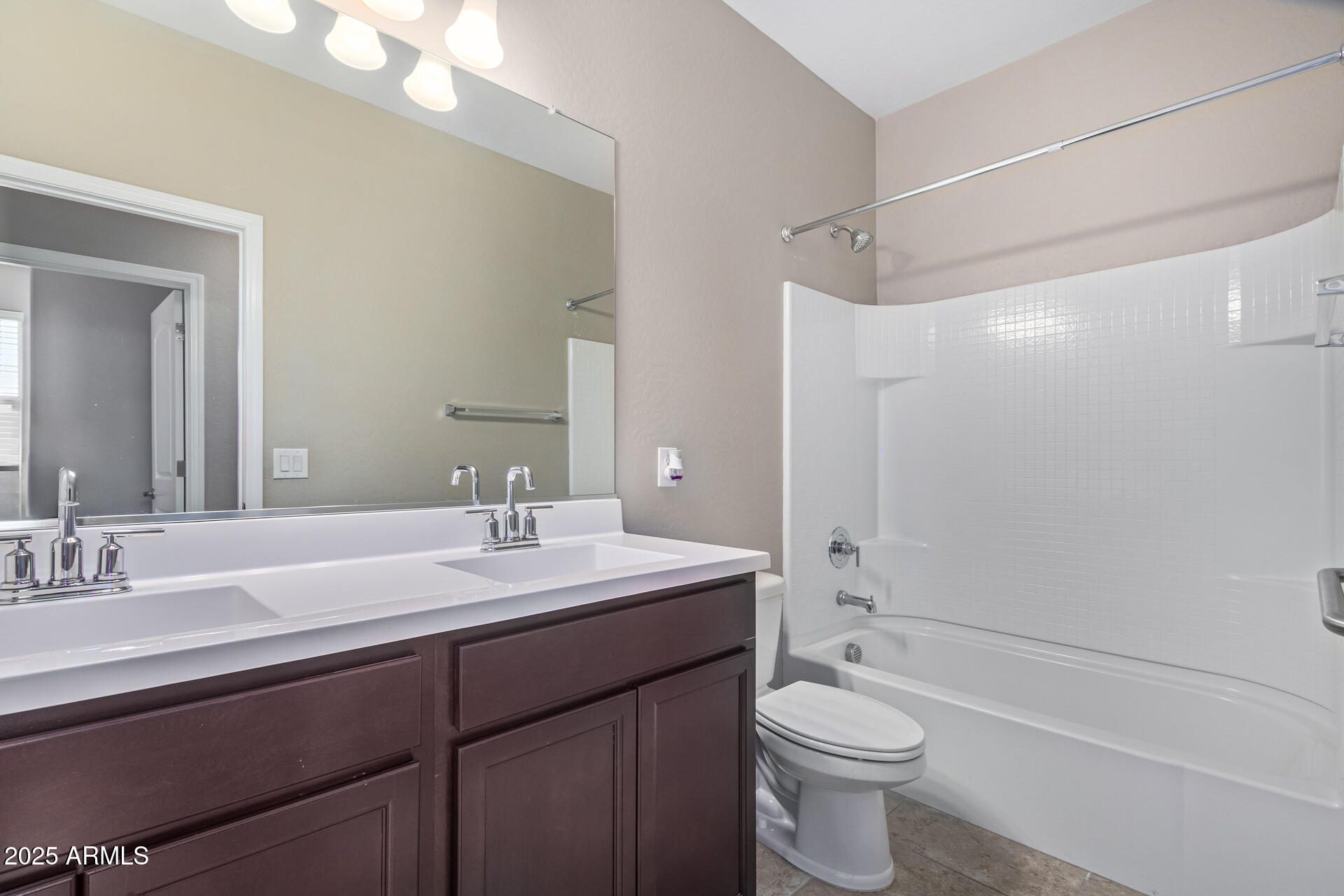 29421 West Mitchell Avenue Buckeye, AZ 85396 - Photo 22 of 40 a bathroom with a sink a toilet and shower