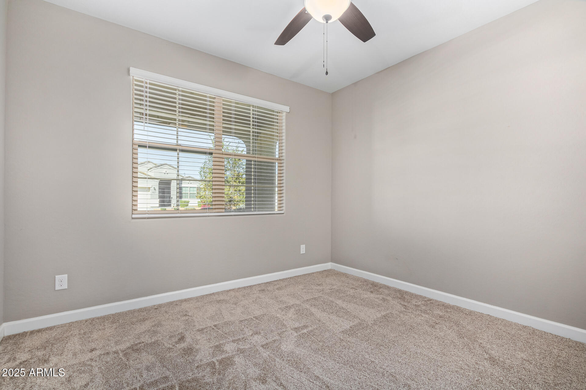 29421 West Mitchell Avenue Buckeye, AZ 85396 - Photo 23 of 40 an empty room with a window