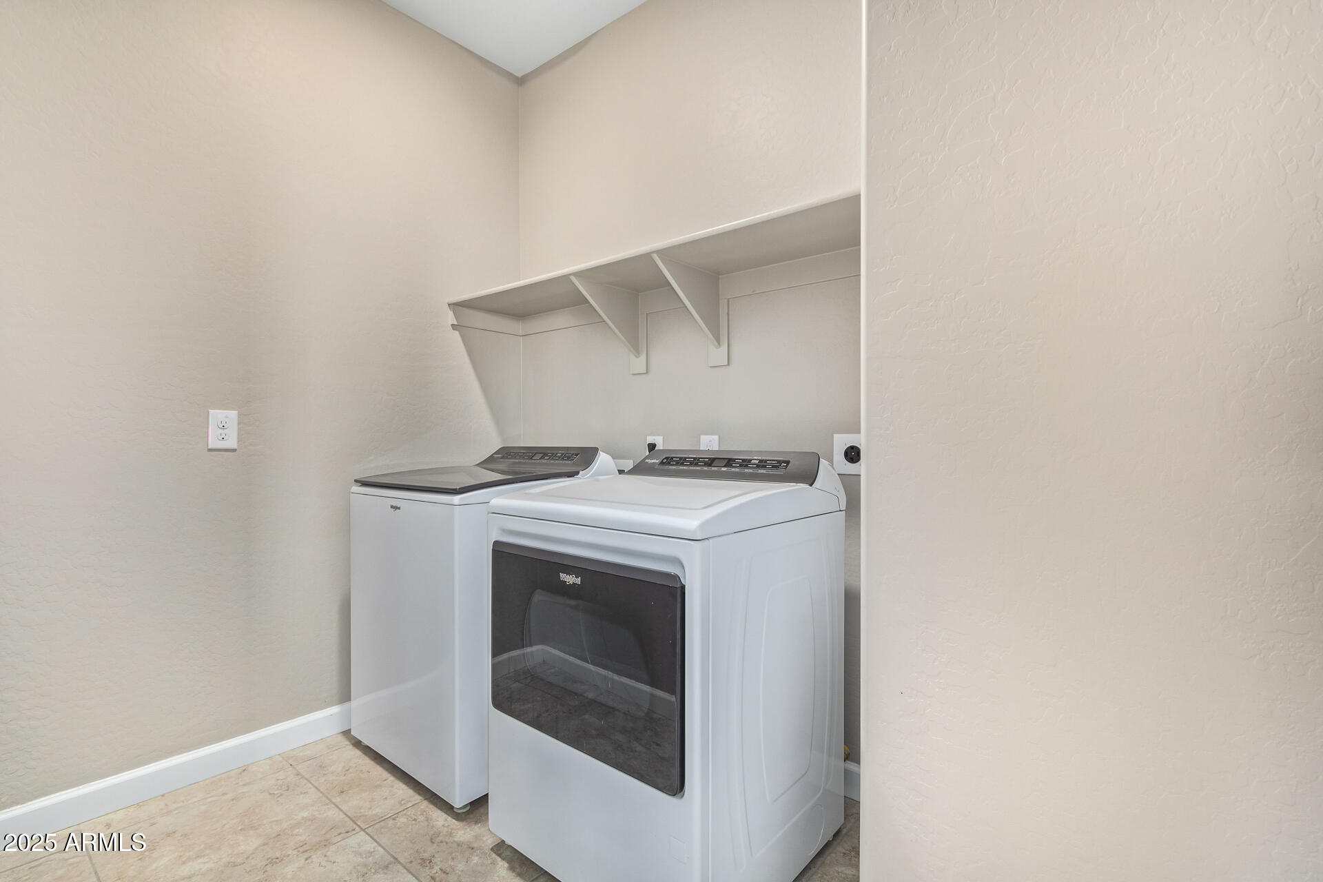 29421 West Mitchell Avenue Buckeye, AZ 85396 - Photo 25 of 40 a utility room with dryer and washer