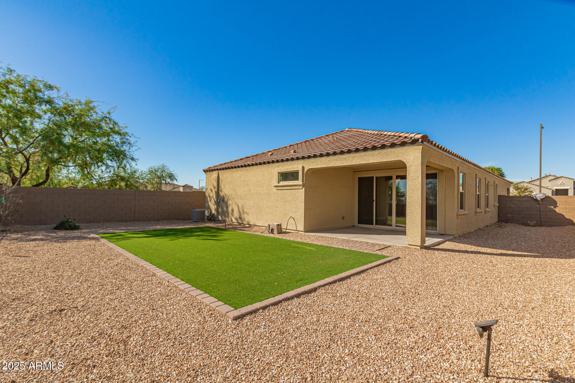 29421 West Mitchell Avenue Buckeye, AZ 85396 - Photo 30 of 40 a front view of a house with a yard