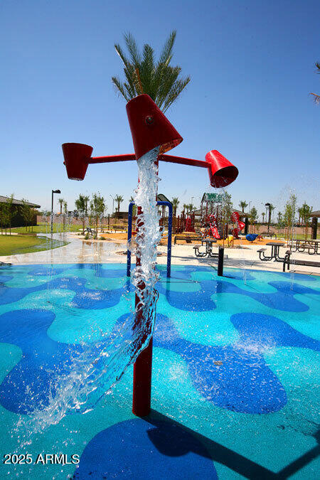 29421 West Mitchell Avenue Buckeye, AZ 85396 - Photo 33 of 40 a view of a swimming pool with a yard