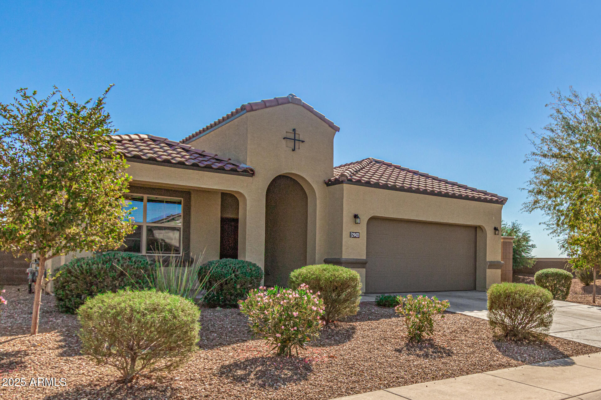 29421 West Mitchell Avenue Buckeye, AZ 85396 - Photo 3 of 40 a front view of a house with yard