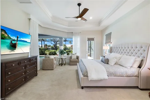 a bedroom with a large bed and a couch