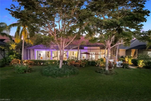 a view of a lake with houses in the back