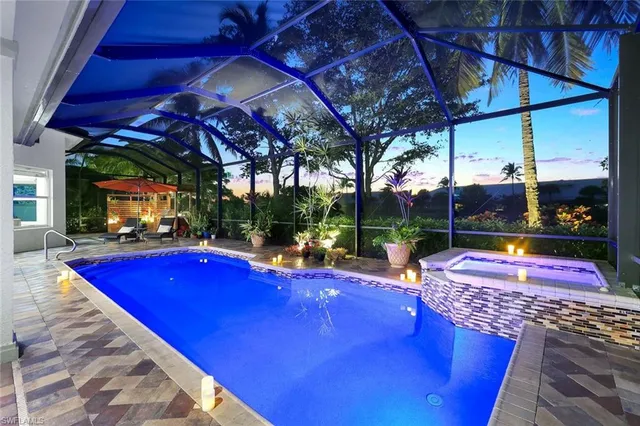 a view of swimming pool with outdoor seating