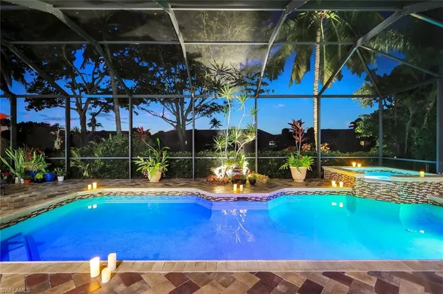 a view of a swimming pool with a patio