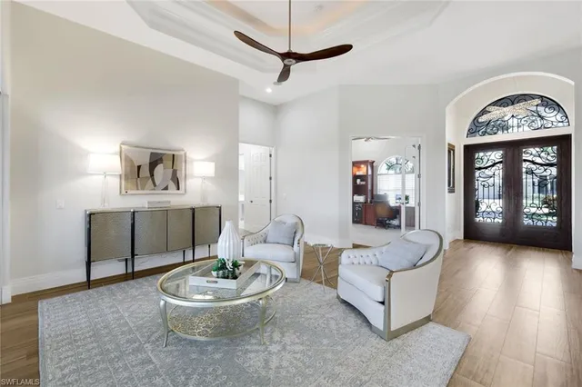 a living room with furniture and a large window