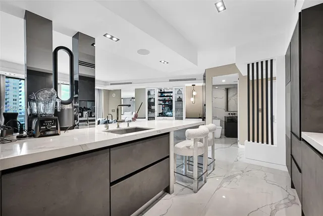 a kitchen with a sink cabinets and window