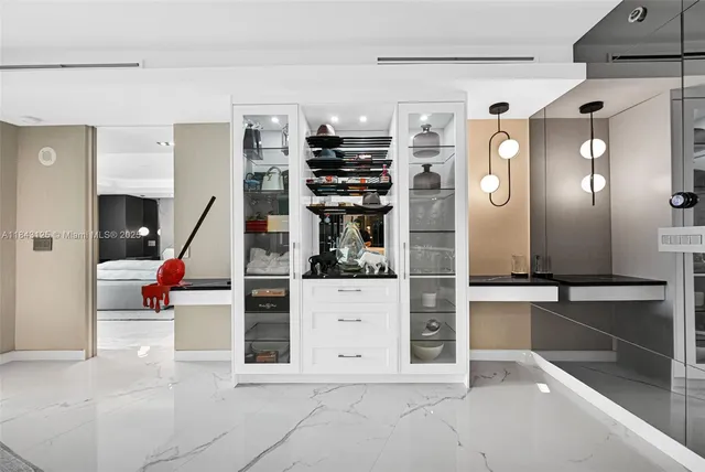 a bedroom with a large bed and a large window