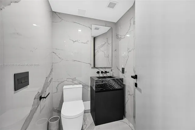 a living room with furniture a large window and a flat screen tv