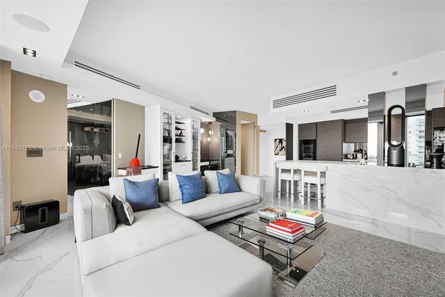 a living room with furniture and a table