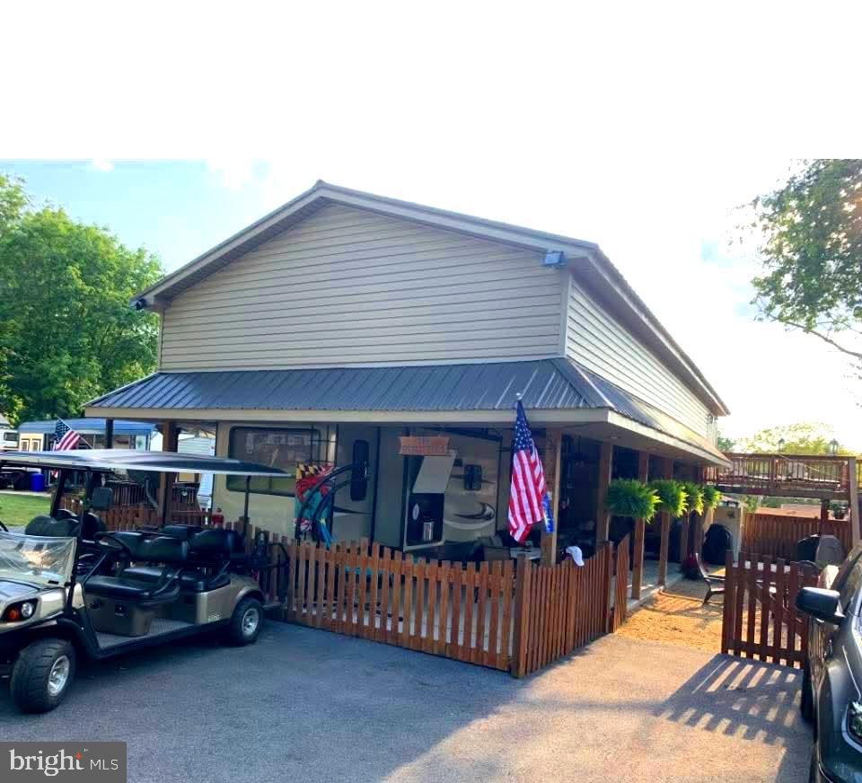a view of a patio with table and chairs under an umbrella