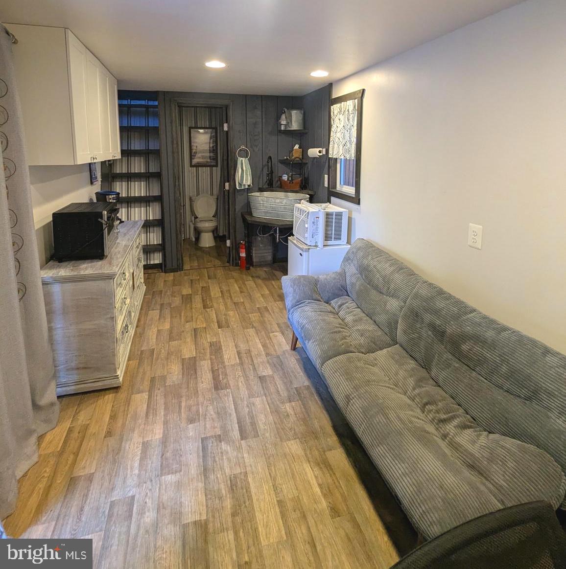4 Butterfly Boulevard Falling Waters, WV 25419 - Photo 15 of 17 a living room with furniture and a wooden floor
