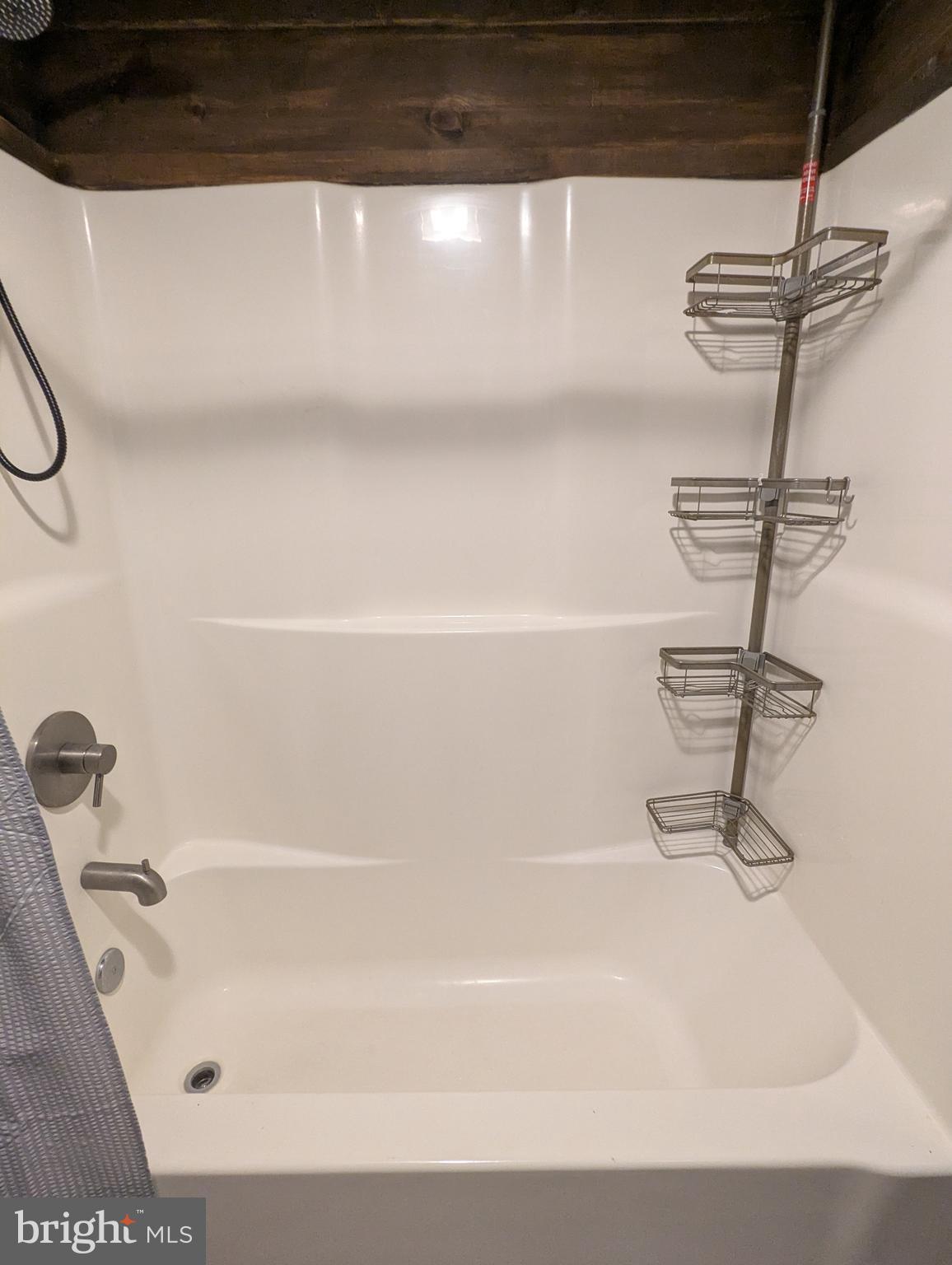 4 Butterfly Boulevard Falling Waters, WV 25419 - Photo 16 of 17 a bathroom with a bathtub and a shower