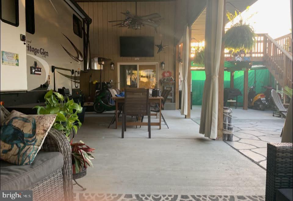 4 Butterfly Boulevard Falling Waters, WV 25419 - Photo 3 of 17 a view of a patio with table and chairs potted plants