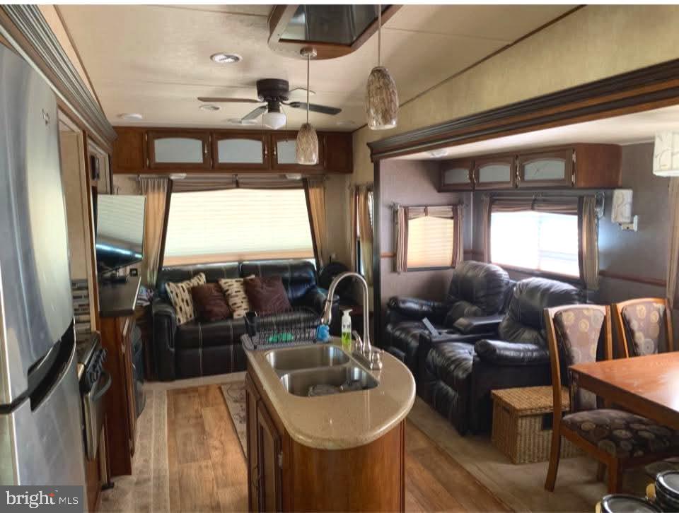 4 Butterfly Boulevard Falling Waters, WV 25419 - Photo 8 of 17 a living room with furniture and a flat screen tv