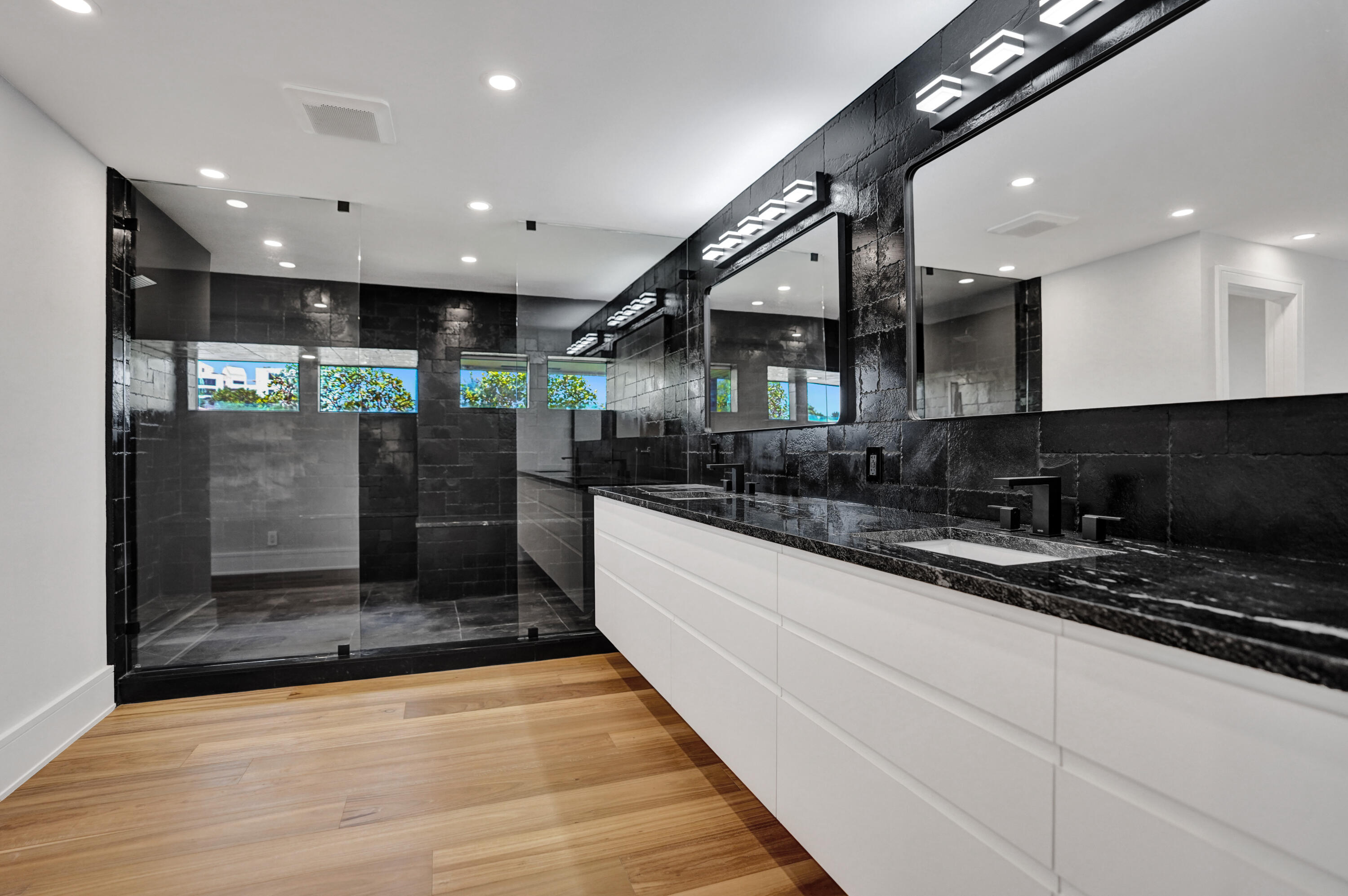 961 Iris Drive Delray Beach, FL 33483 - Photo 16 of 59 a large kitchen with stainless steel appliances kitchen island a large counter top a stove and a refrigerator