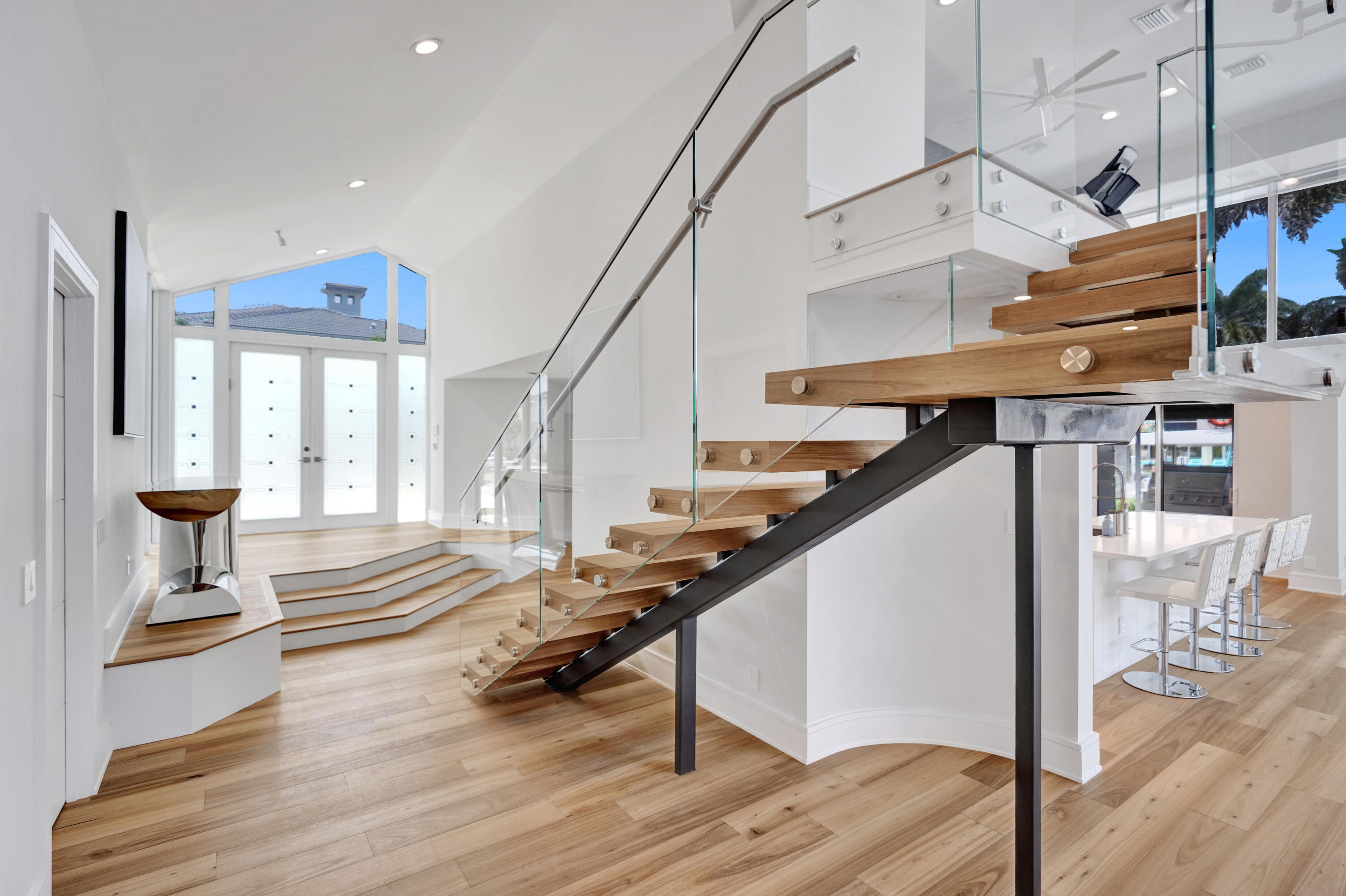 961 Iris Drive Delray Beach, FL 33483 - Photo 26 of 59 a view of entryway and hall with wooden floor