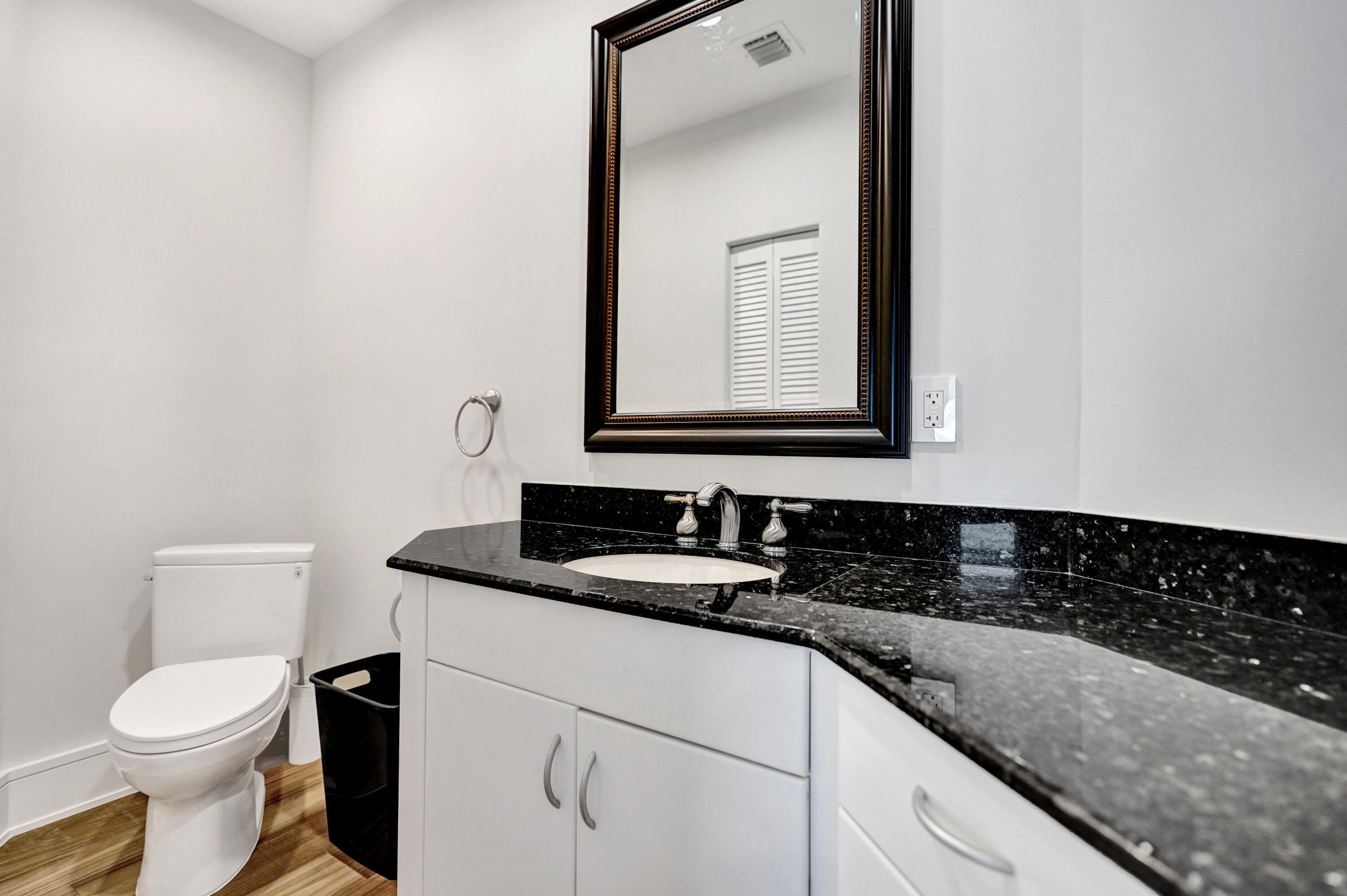 961 Iris Drive Delray Beach, FL 33483 - Photo 29 of 59 a bathroom with a granite countertop sink and a toilet