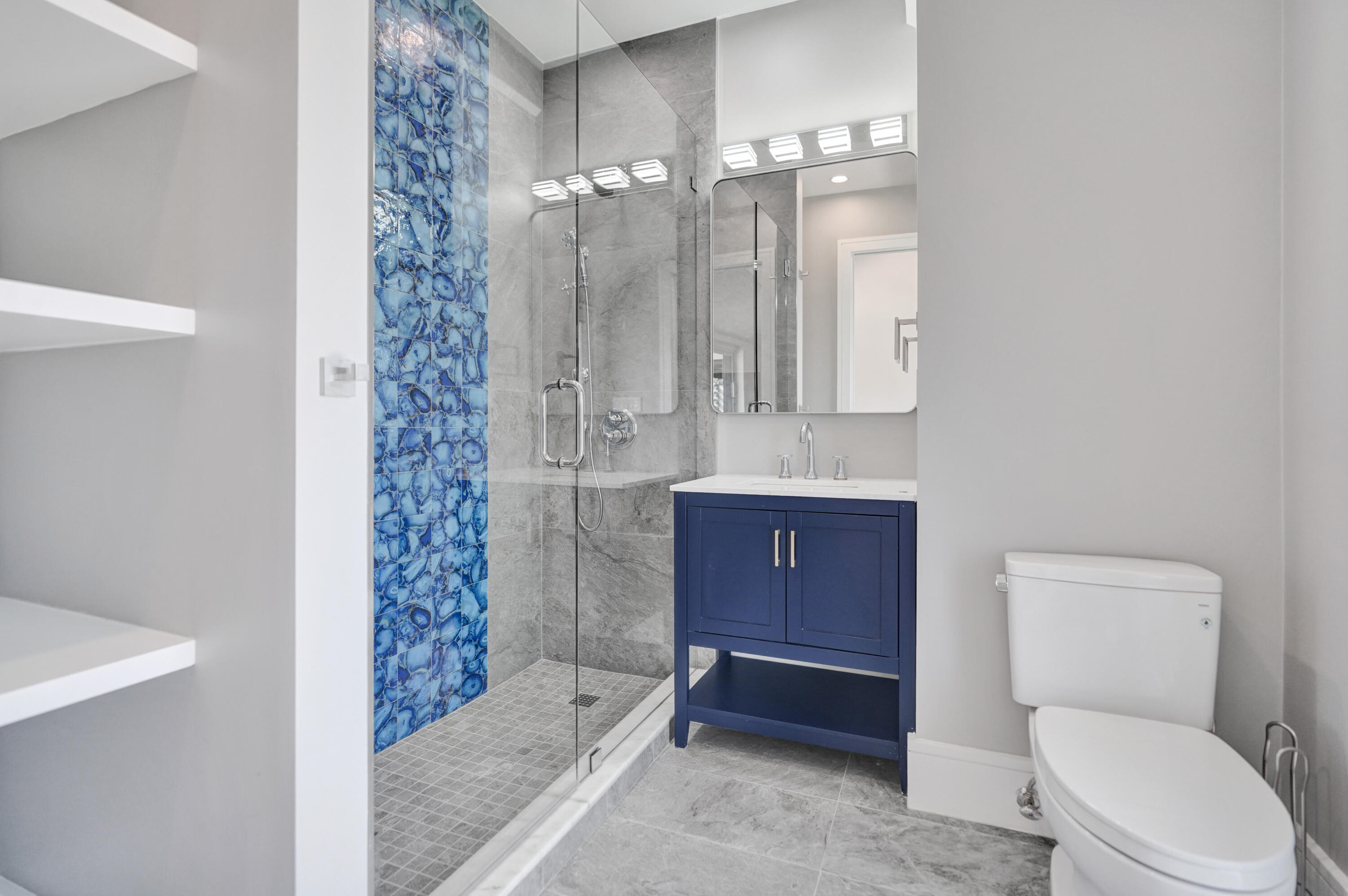 961 Iris Drive Delray Beach, FL 33483 - Photo 34 of 59 a bathroom with a toilet a sink and shower