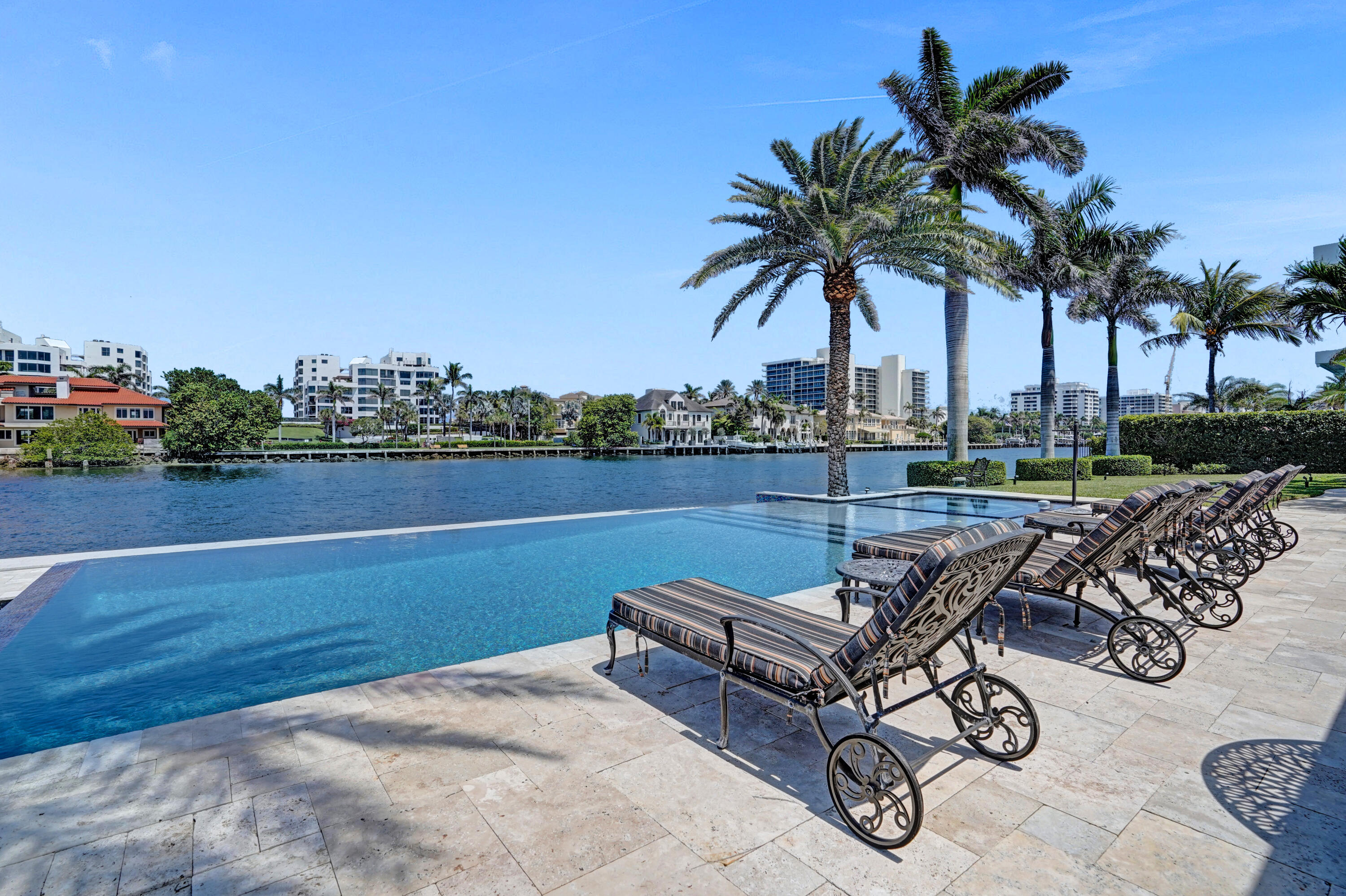 961 Iris Drive Delray Beach, FL 33483 - Photo 41 of 59 a view of a swimming pool with lounge chairs