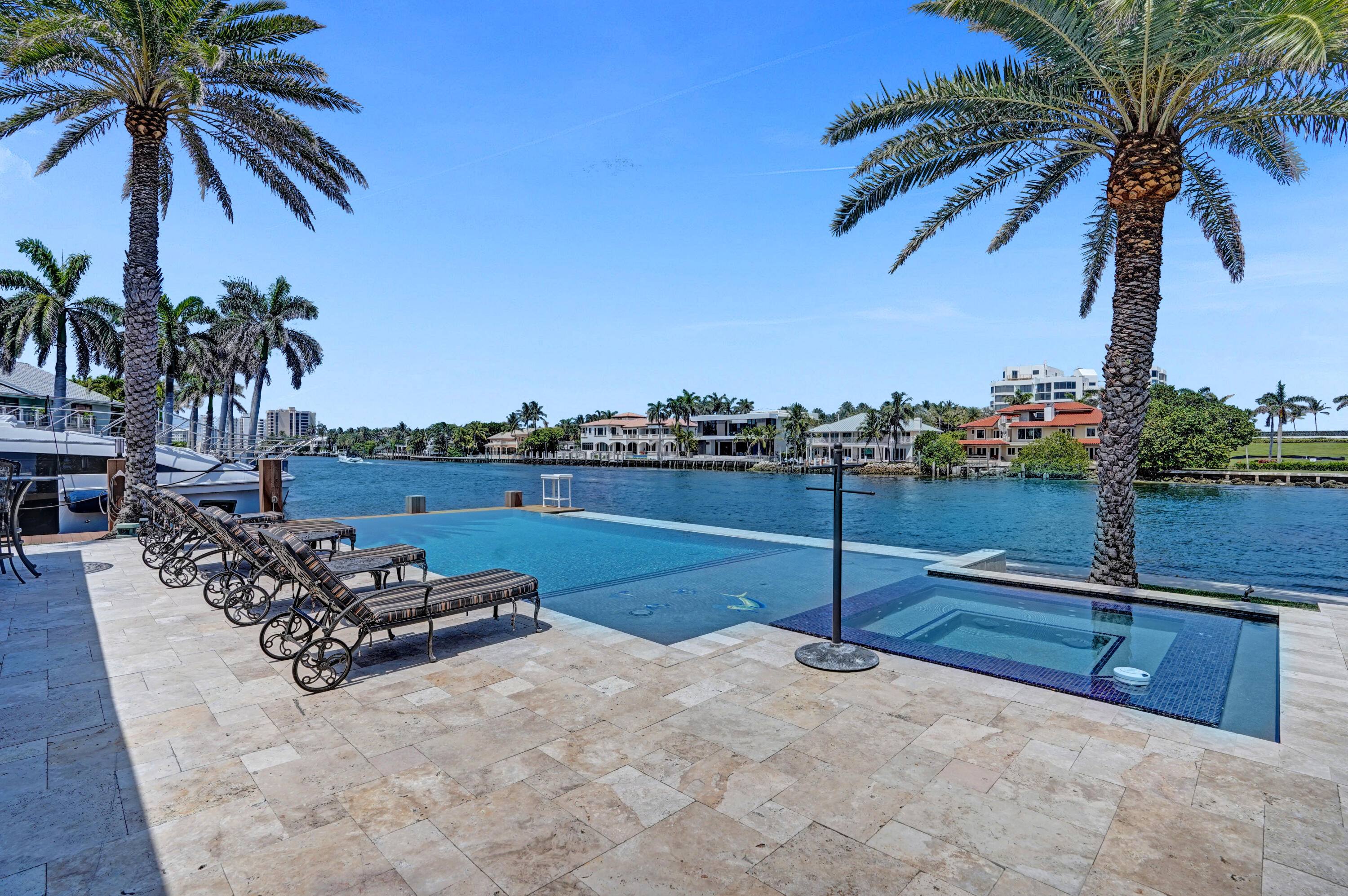 961 Iris Drive Delray Beach, FL 33483 - Photo 42 of 59 a view of a terrace with wooden fence