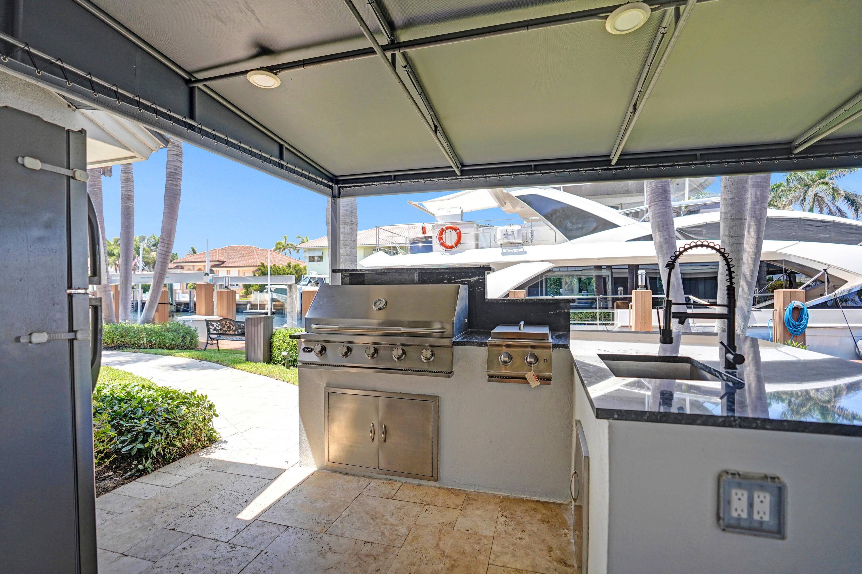 961 Iris Drive Delray Beach, FL 33483 - Photo 48 of 59 a kitchen with a stove and a microwave