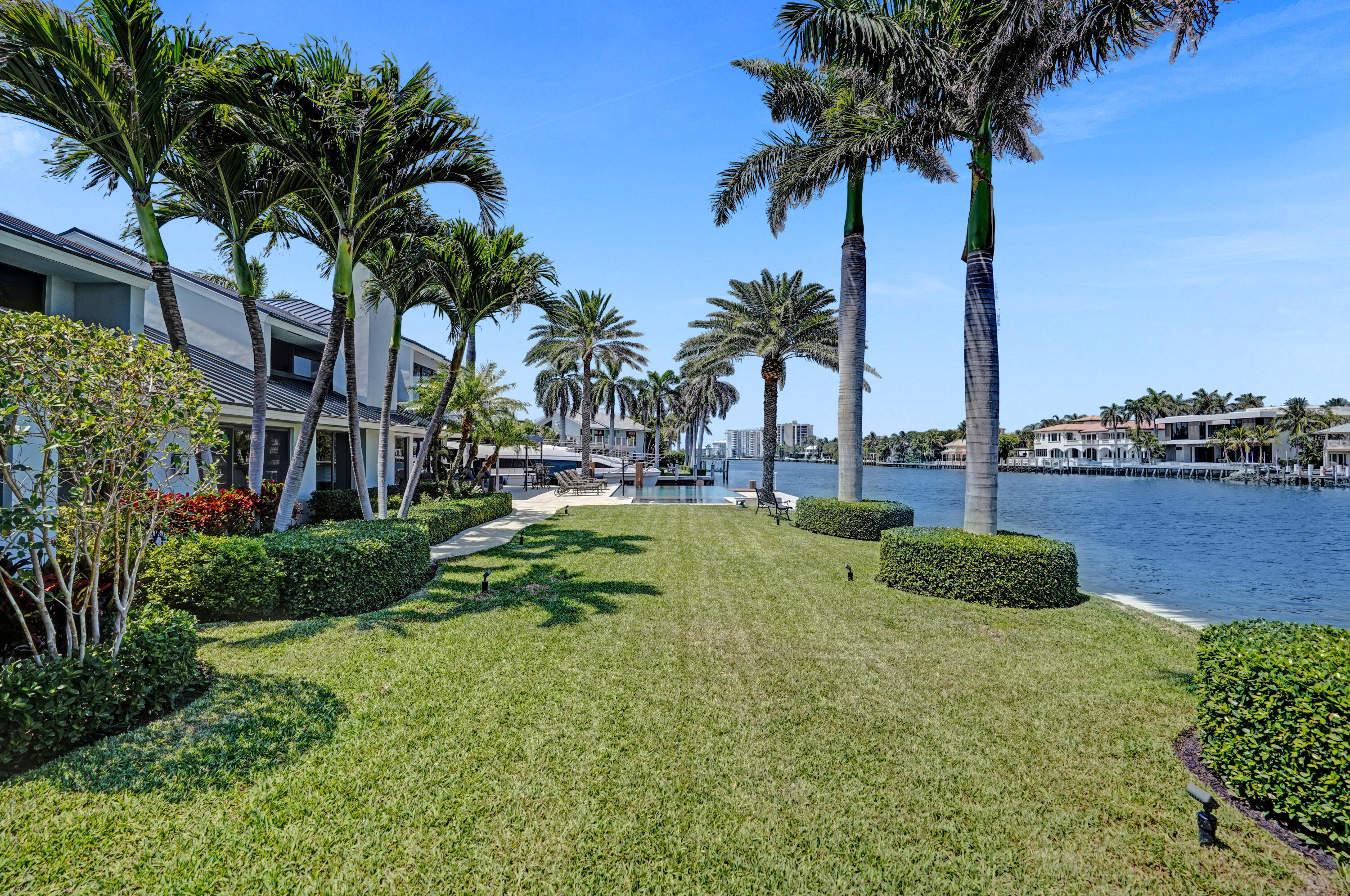 961 Iris Drive Delray Beach, FL 33483 - Photo 50 of 59 a view of a garden with a palm tree