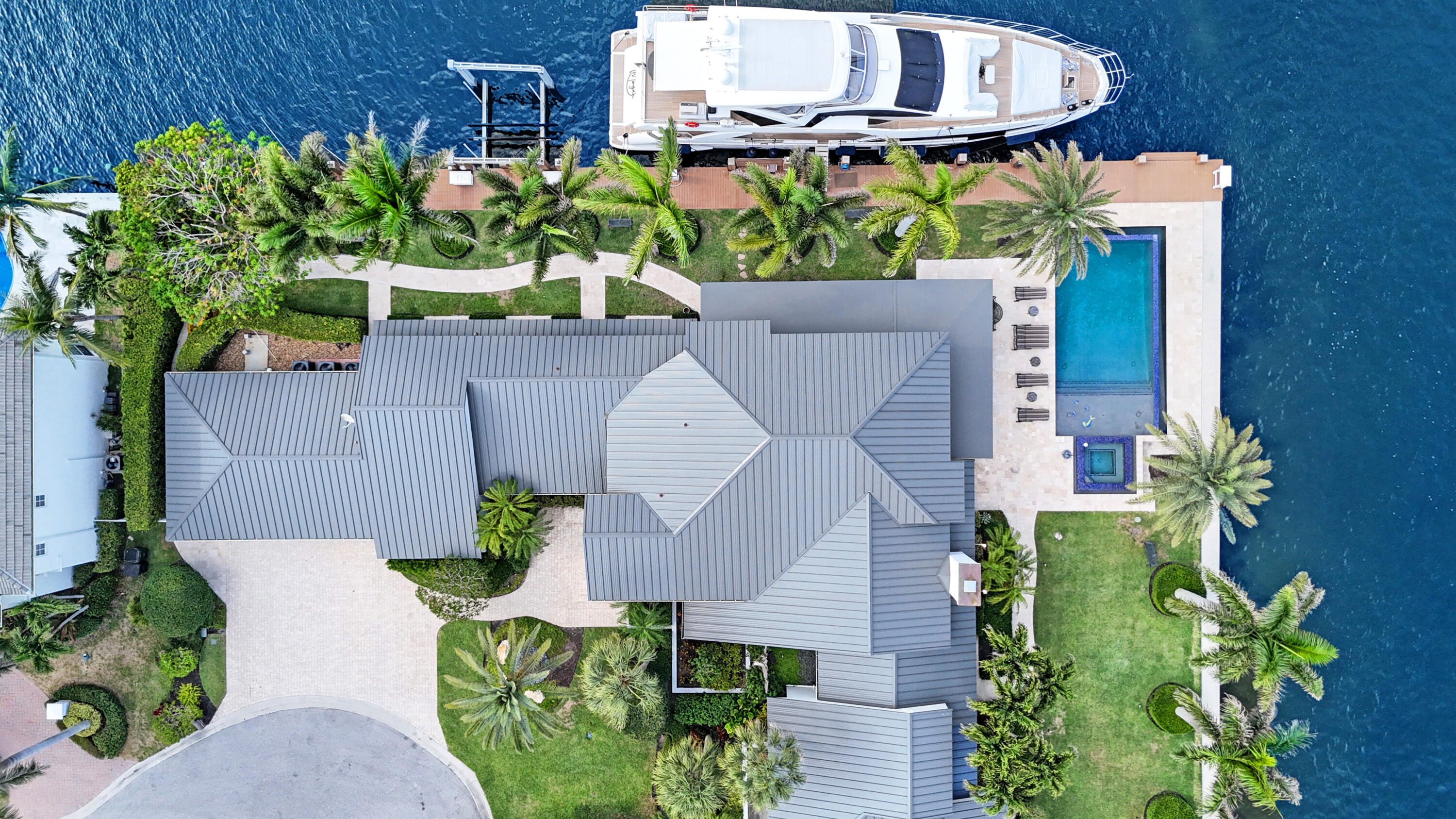 961 Iris Drive Delray Beach, FL 33483 - Photo 53 of 59 a aerial view of a house with a yard and garden