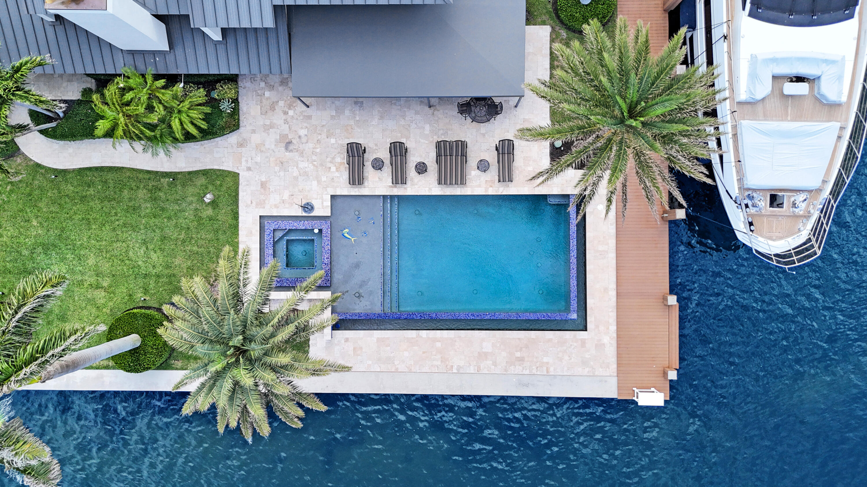 961 Iris Drive Delray Beach, FL 33483 - Photo 54 of 59 a potted plant sitting on top of a wooden floor