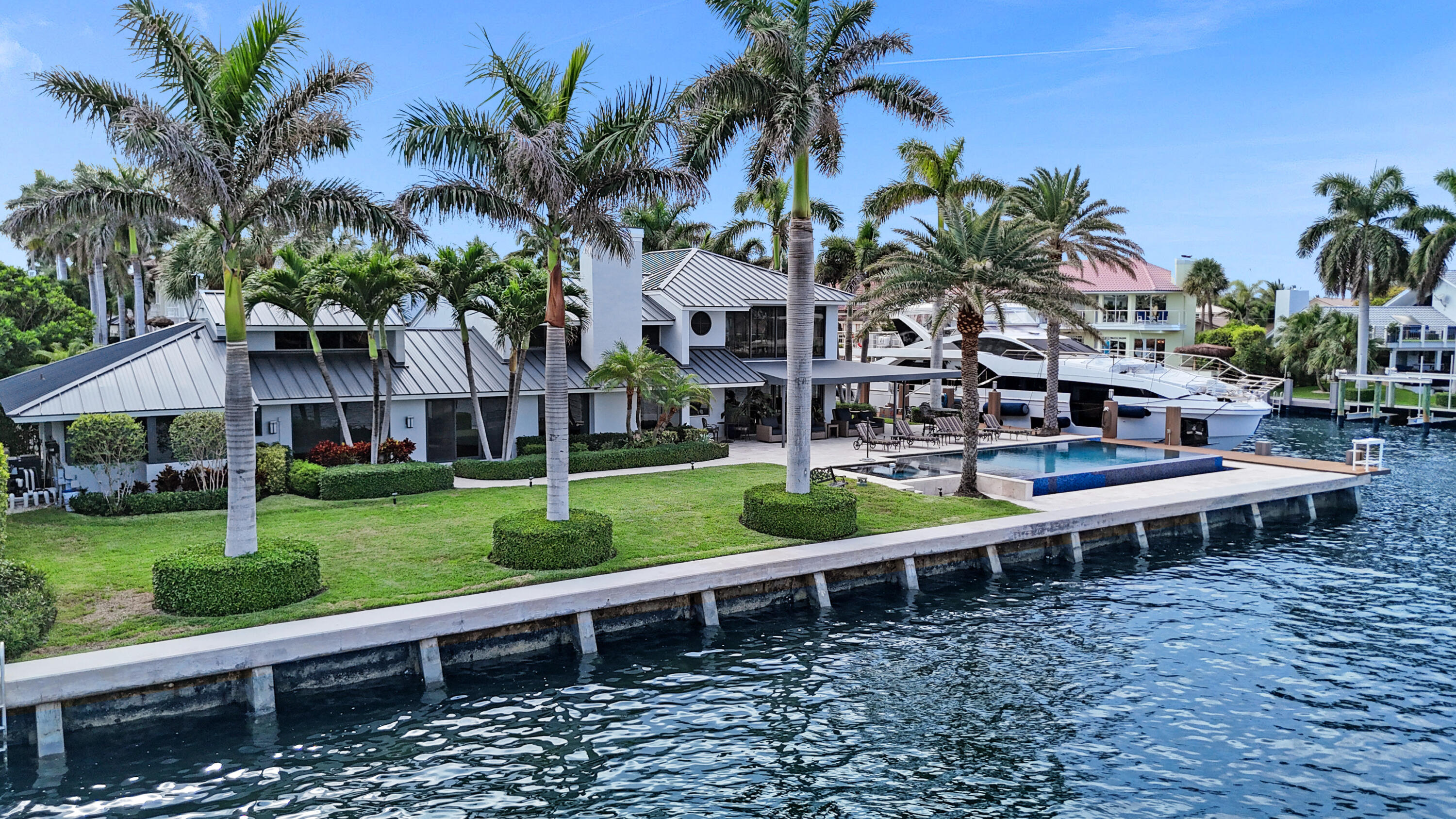 961 Iris Drive Delray Beach, FL 33483 - Photo 56 of 59 a view of a house with a yard and sitting area