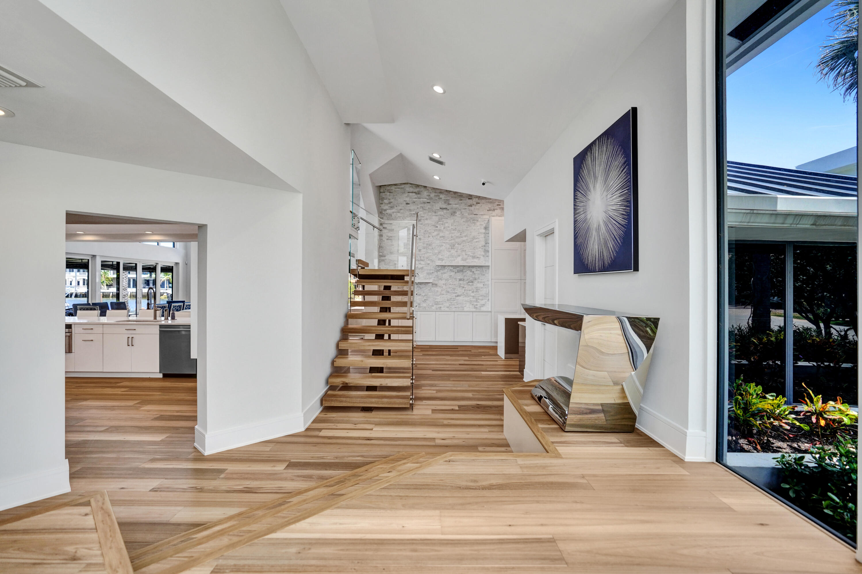 961 Iris Drive Delray Beach, FL 33483 - Photo 6 of 59 a view of entryway and hall with wooden floor