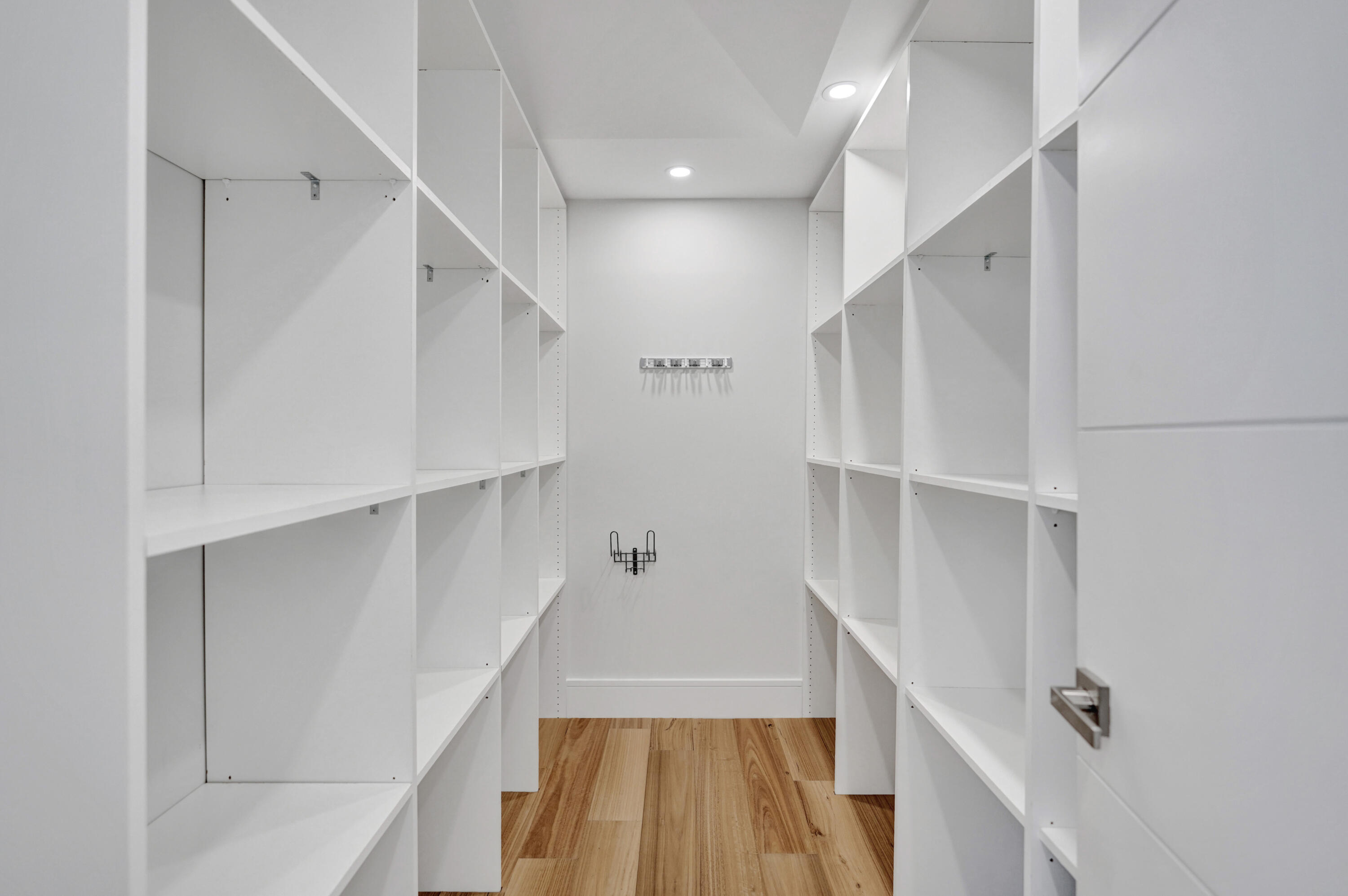 961 Iris Drive Delray Beach, FL 33483 - Photo 8 of 59 a view of walk in closet with empty racks