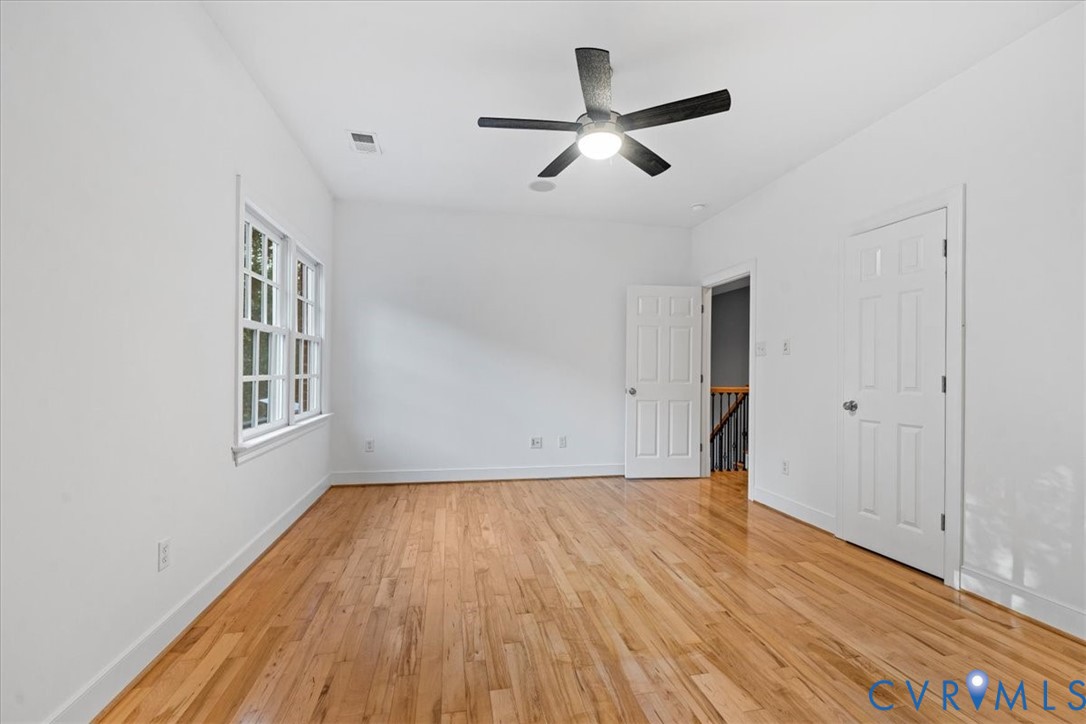 3308 Yarding Way Toano, VA 23168 - Photo 65 of 83 a view of empty room with wooden floor and fan