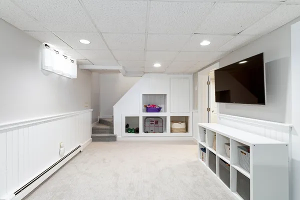 a view of a livingroom with furniture and a flat screen tv