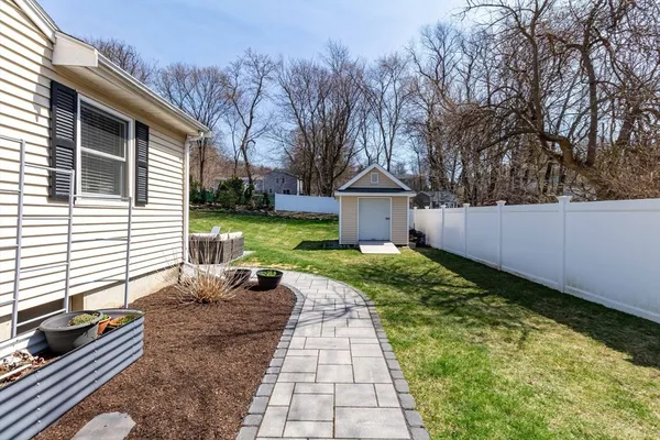 a view of a patio with a yard