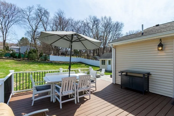 a view of a backyard with swimming pool