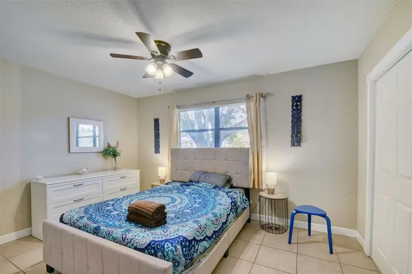 a bedroom with a bed and window