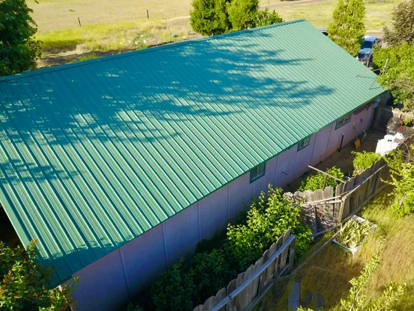 a backyard of a house with seating space and hardwood floor