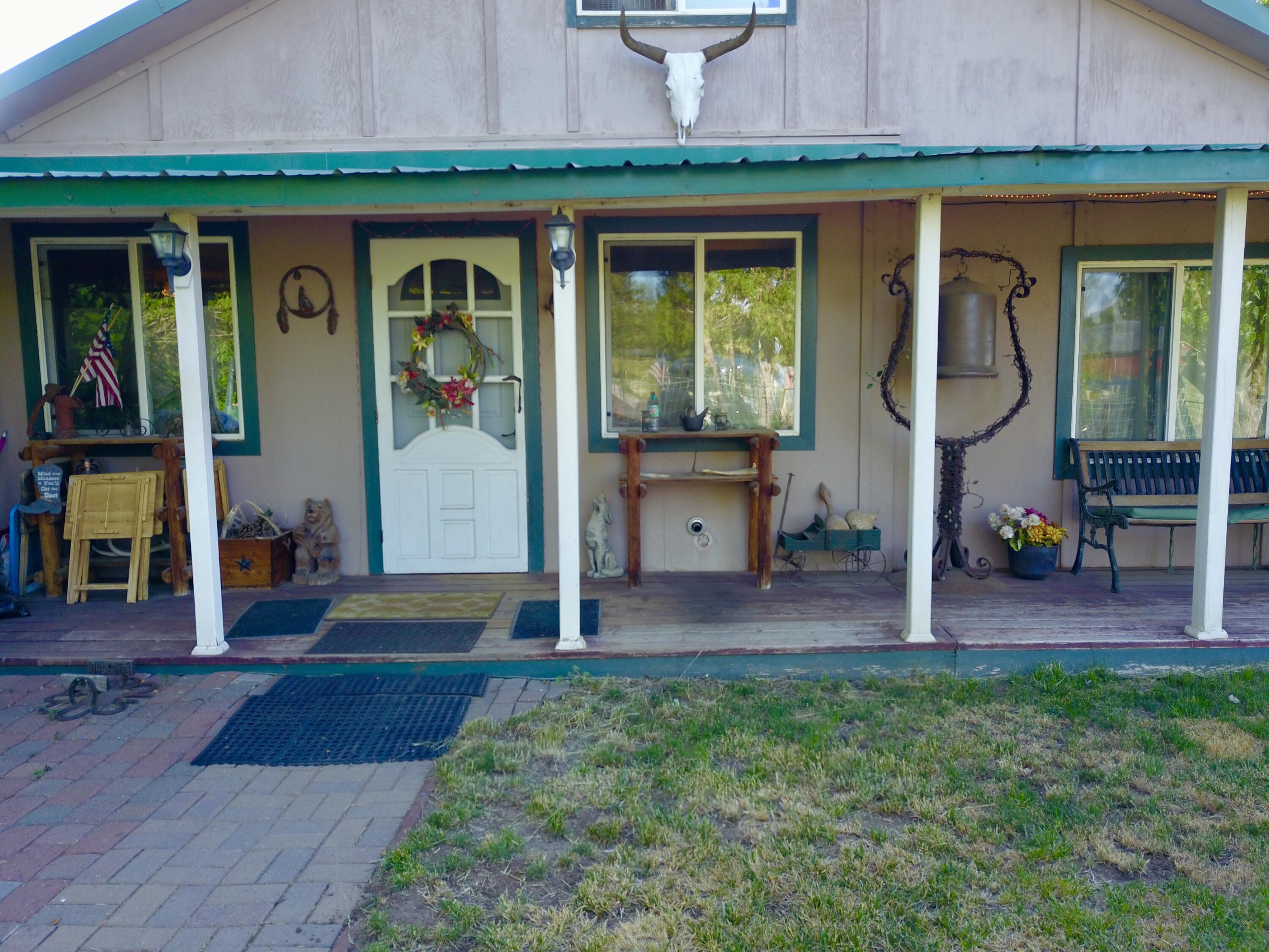 25965 Cir Bell Road Fall River Mills, CA 96028 - Photo 15 of 53 a backyard of a house with seating space and hardwood floor