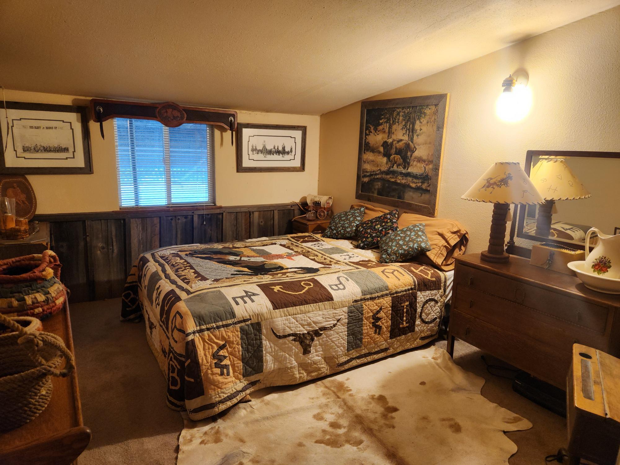 25965 Cir Bell Road Fall River Mills, CA 96028 - Photo 19 of 53 a bedroom with a bed and lamp