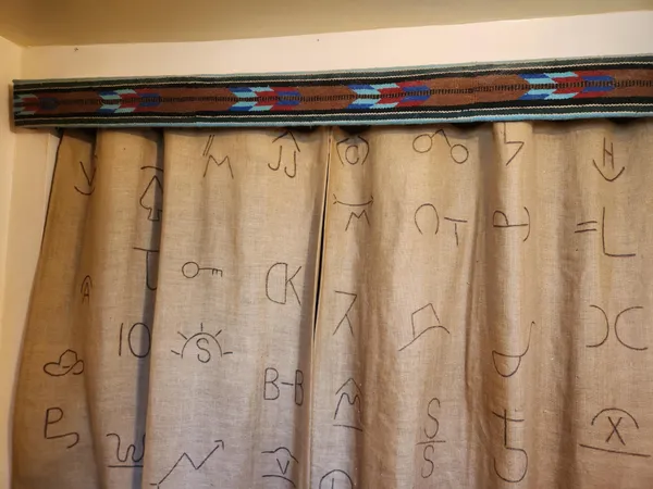 a kitchen with a sink and a stove with wooden floor