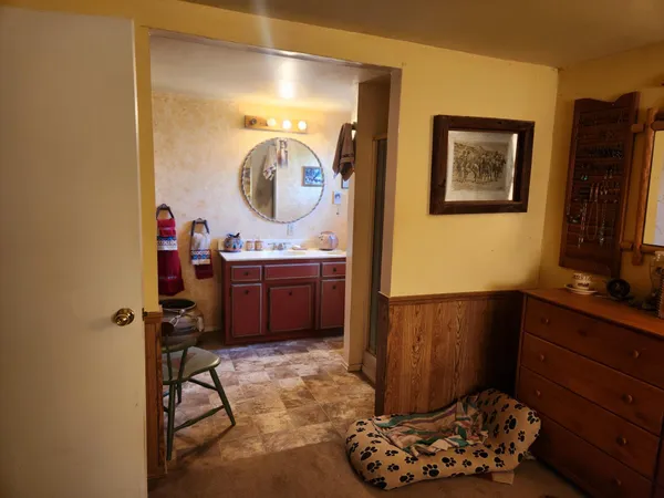 a living room with furniture and next to a window
