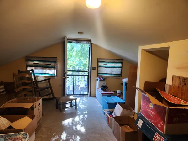 a room with furniture and large windows