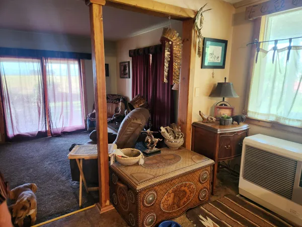 a living room with furniture and a lamp