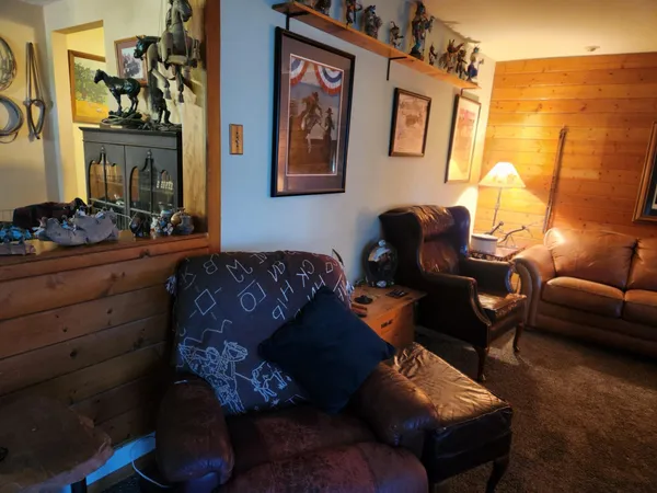a view of a chairs and table in a room
