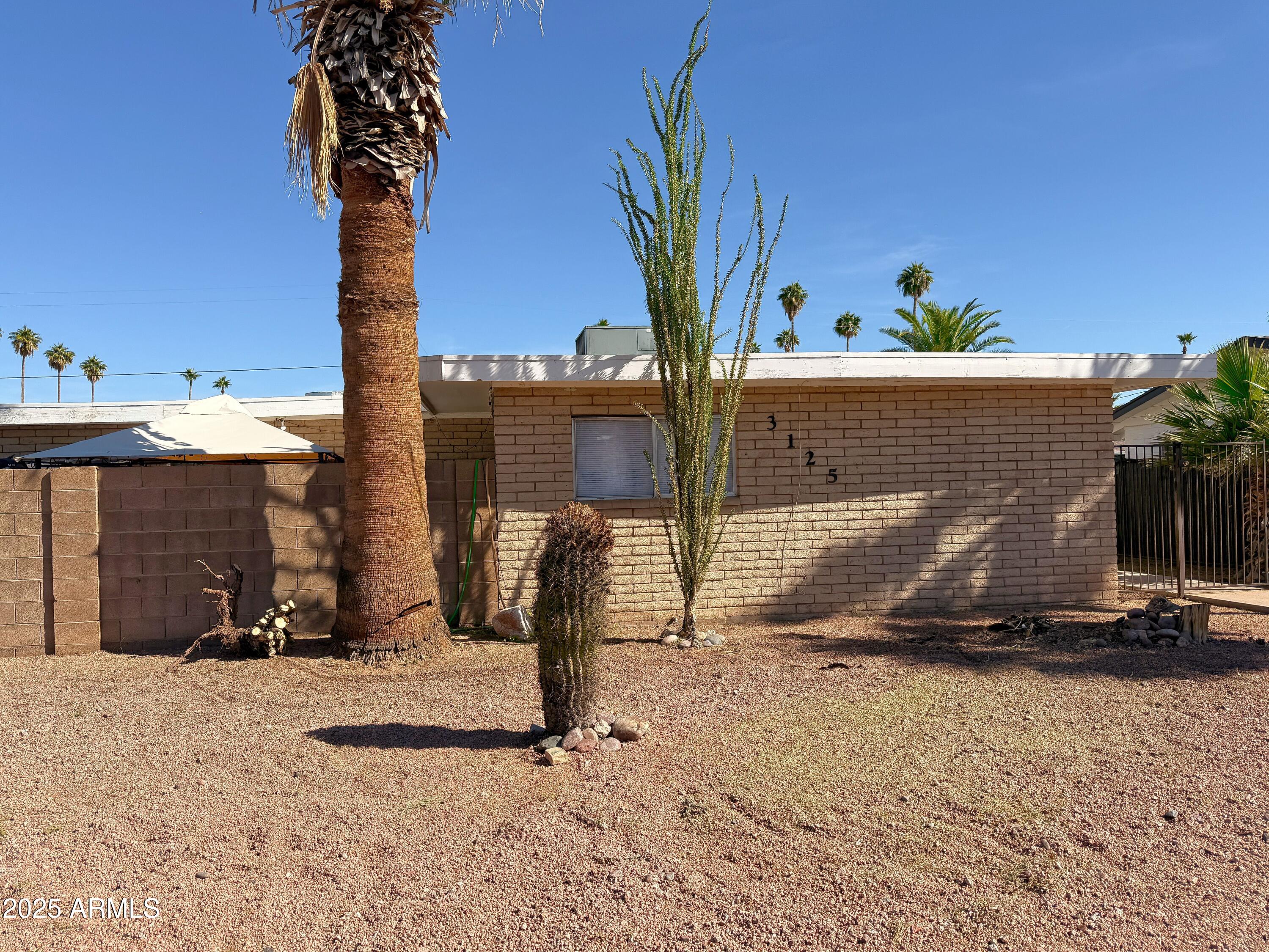 3125 North 66th Street, Unit 2 Scottsdale, AZ 85251 - Photo 1 of 10 a view of a backyard