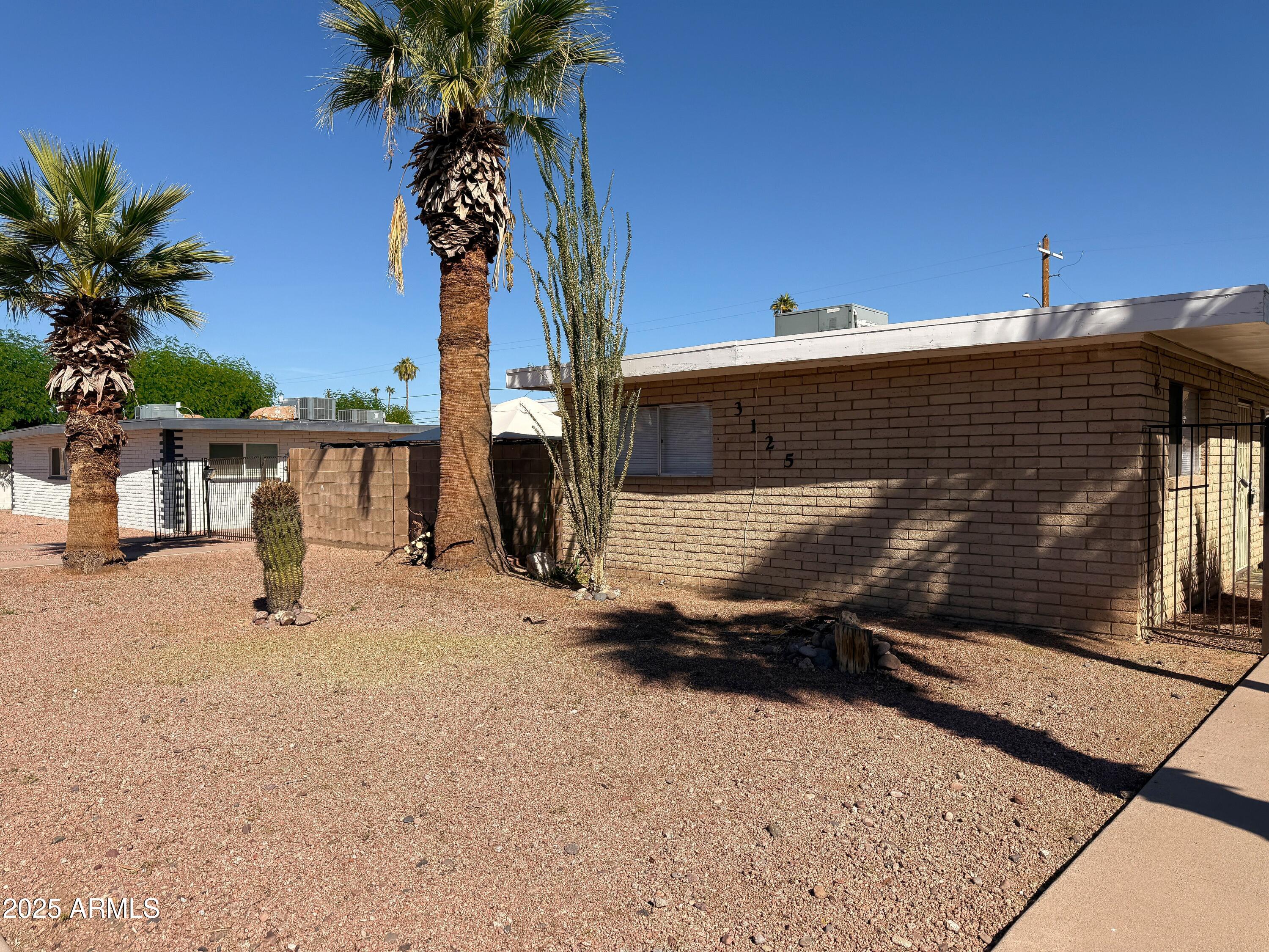3125 North 66th Street, Unit 2 Scottsdale, AZ 85251 - Photo 2 of 10 a view of a house with a patio