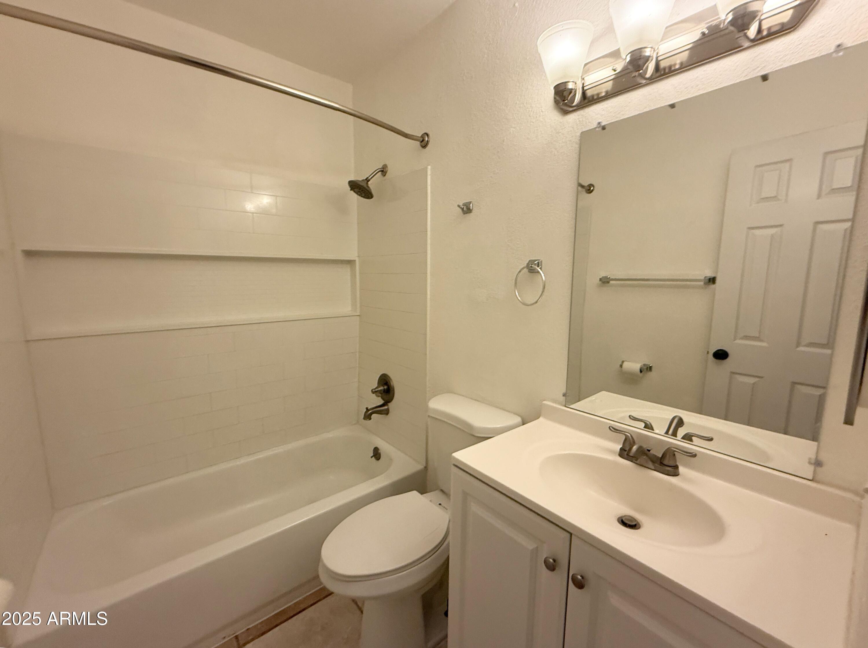 3125 North 66th Street, Unit 2 Scottsdale, AZ 85251 - Photo 9 of 10 a bathroom with a sink mirror toilet and bathtub