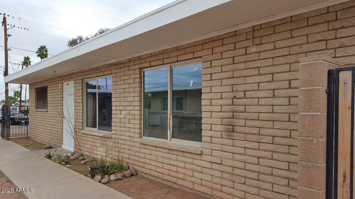 3125 North 66th Street, Unit 2 Scottsdale, AZ 85251 - Photo 10 of 10 a front view of a house with an empty space